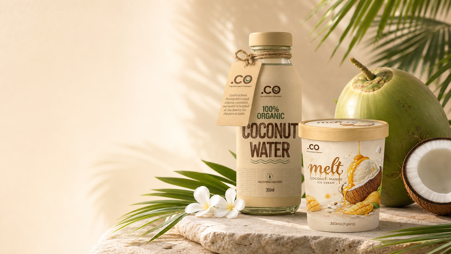 .CO Coconut Water and Melt.CO mango coconut ice cream on travertine with fresh coconuts